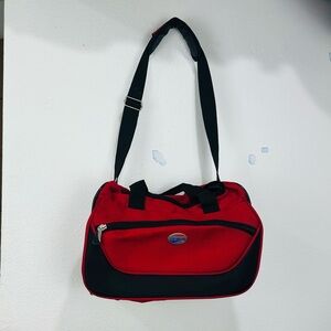 American Tourister Red and Black Duffel Bag